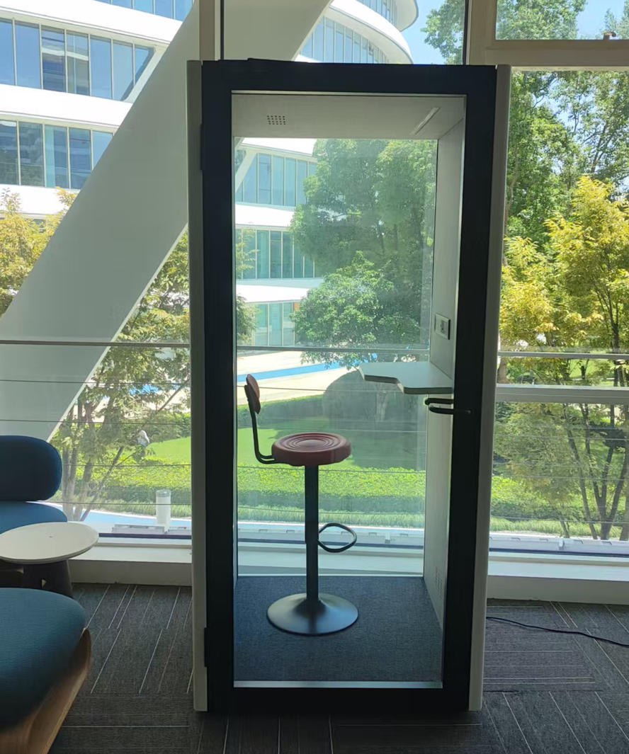 Acoustic Silent Booth | Soundproof Office Phone Pod Acoustic silent booth interior view showing comfortable seating, table and acoustic panels for noise reduction